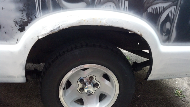 That grey bit at the 11 o’clock position? Duct tape. Behind that? Cardboard and sanding screen for extra strength. Oh yea.